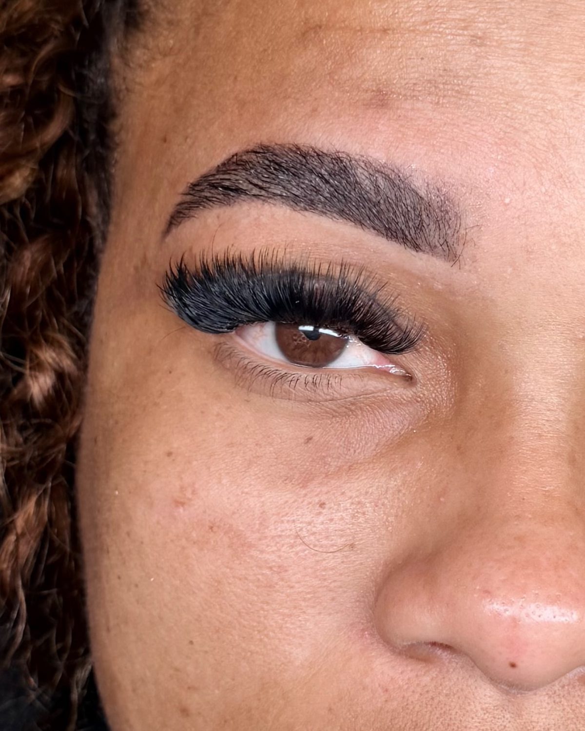Close-up of a client's full volume lash extensions